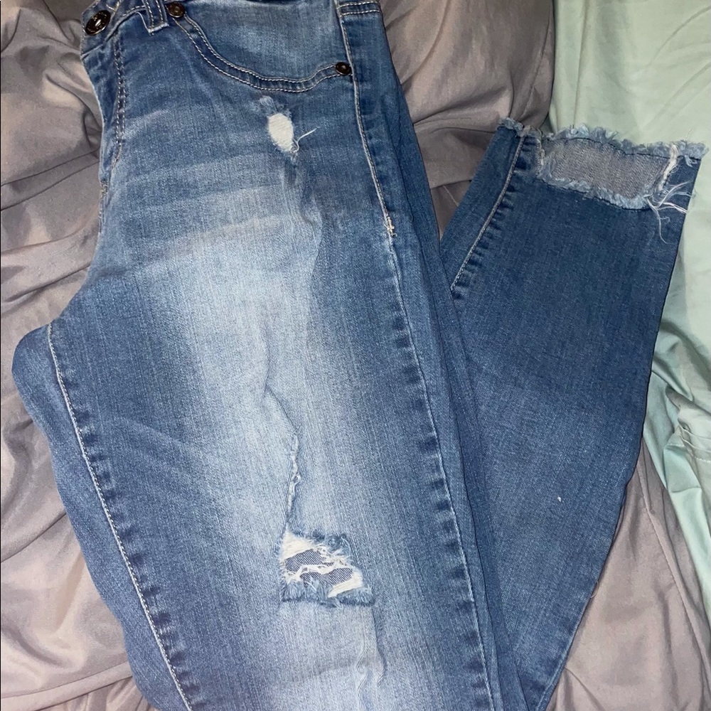 Distressed light wash skinny jeans